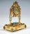 Artfully decorated silver gilded table clock by a Viennese master: Flat, rectangular corpus containing the musical...