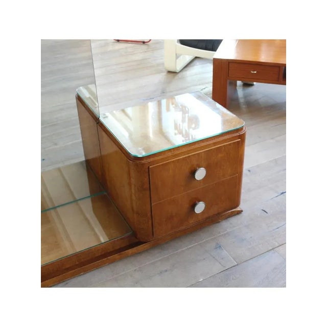 Wood and burl wood structure, glass shelves, and large full-length mirror. Two practical, smooth-sliding drawers with...