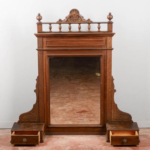 This elegant freestanding mirror, dating back to the mid-twentieth century, represents a classic example of a dressing...