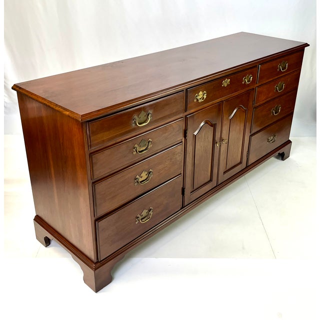 Triple dresser by the prestigious Henkel Harris of Winchester, Virginia constructed from Solid Wild Black Cherry. This...