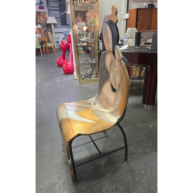 Fantastic wooden chairs still on a steel base and is painted with gold, silver and black tones. Also has wonderful carving...