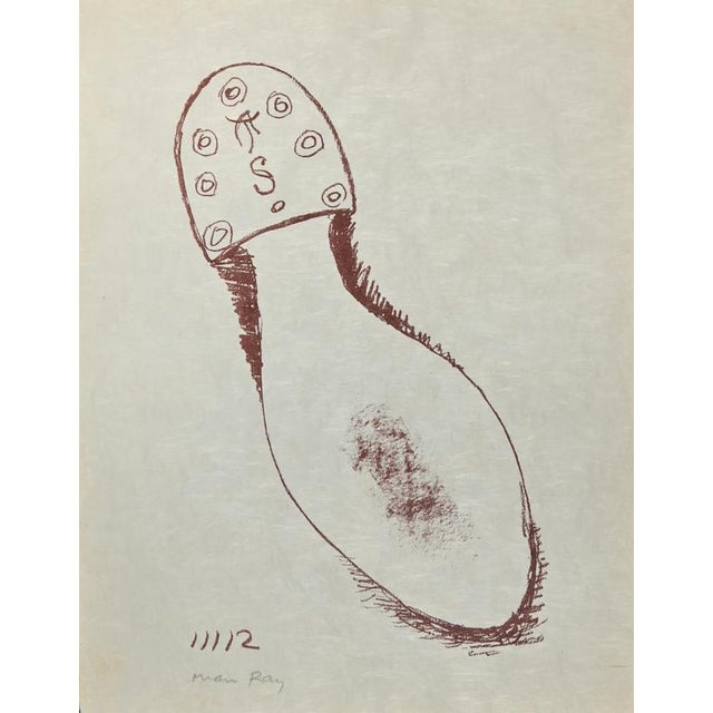 The Absolute Real is a lithograph realized by Man Ray in 1964. Hand-singed in pencil by the Artist. Lithograph in Red Ink,...