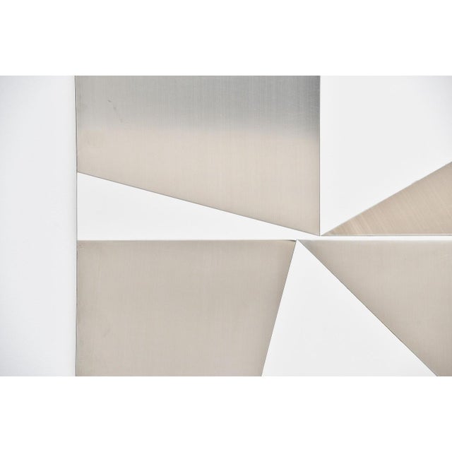 Large abstract modern triangles shaped stainless steel wall artwork designed by Rudolf Wolf and manufactured in his own...