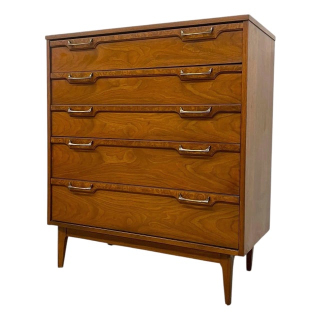 Vintage Mid Century Modern Four Drawer Dresser With Sculpted Drawer Fronts and Brass-Toned Pulls For Sale
