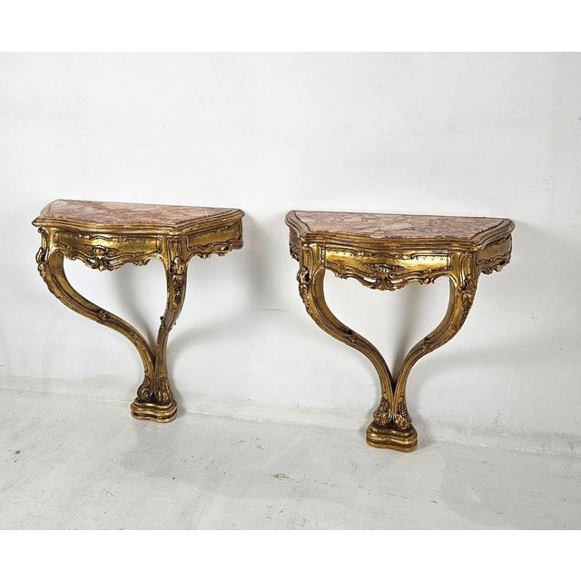 Elegant pair of hand-carved Venetian console night stands, Italy, circa 1930s, executed in the refined tradition of...