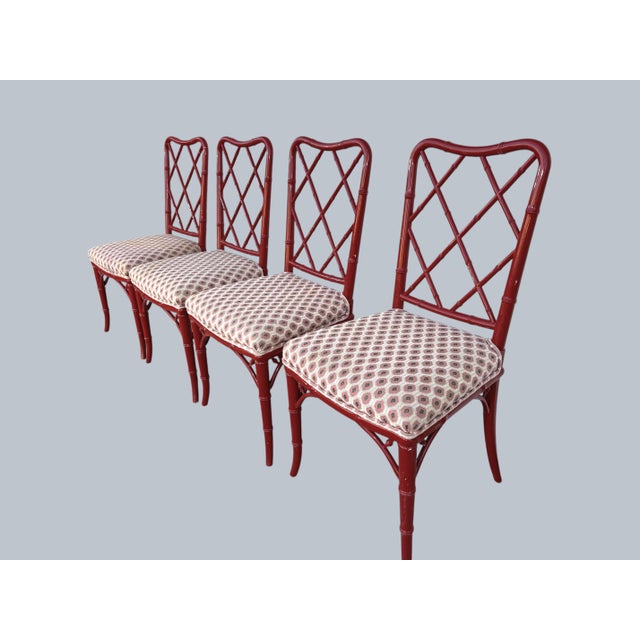 A set of Faux-Bamboo Dining Chairs. Red lacquer finish and lattice backs. Retro Regency style ,original upholstery.