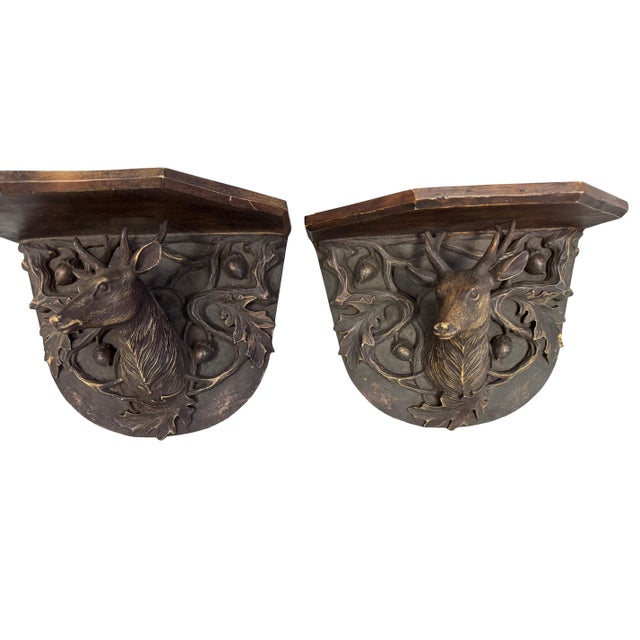 Pair of Black Forest Stag Wall shelves decorated with vines, leaves and acorns. 11.0" W x 8.5" H x 6.0" D
