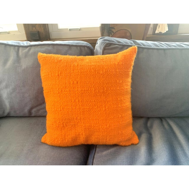 Vivid tangerine decorative pillow with nice woven knit texture. 14" x 14" x 5.5” deep Great vintage condition. Minor piling.