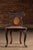 Exceptionally decorative Black Forest walnut valet chair combining seating and storage in a highly carved form. The back...