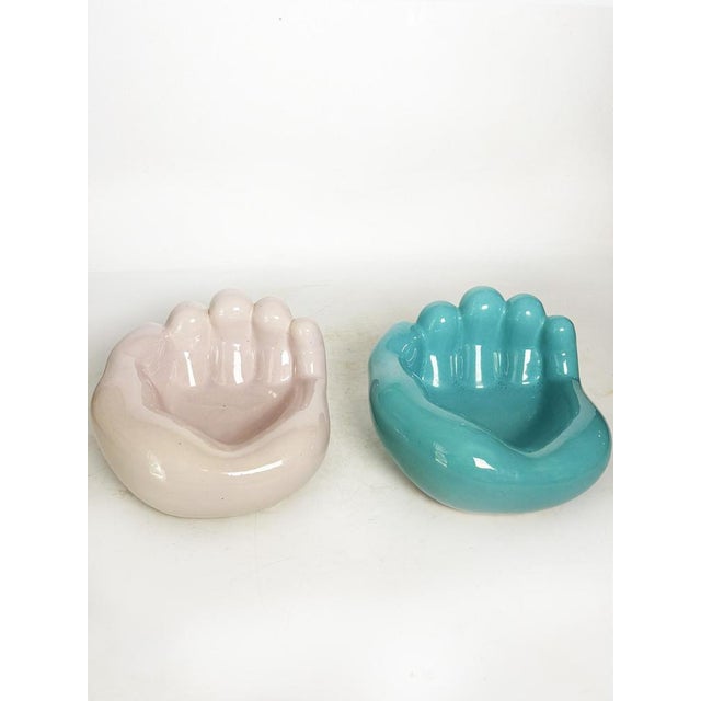Pair of glazed ceramic ashtrays in the shape of bear paws, made in France in the 1970s. This pair of vintage ashtrays,...
