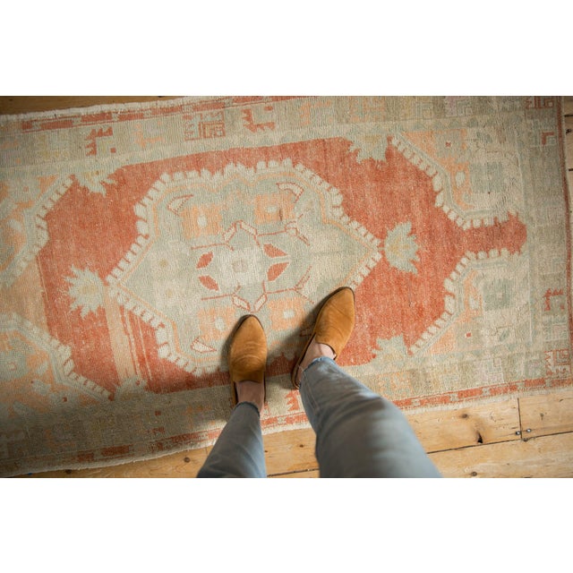 :: Oversized center medallion with four floral top views with stems interconnecting adored at either end by minor finials...