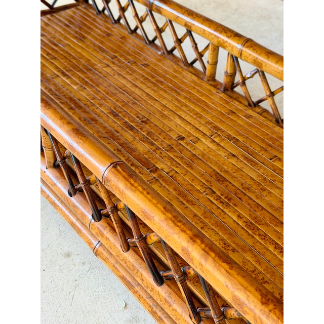 Beautiful vintage Brighton Pavilion style scorched bamboo étagère by Goldenrod, showcasing classic lattice fretwork,...