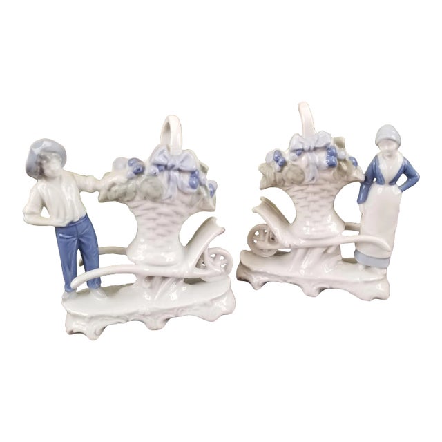 Pair 1920s Erphila Blue & White Porcelain Farmers With Large Basket Bud Vases on Wheelbarrows For Sale