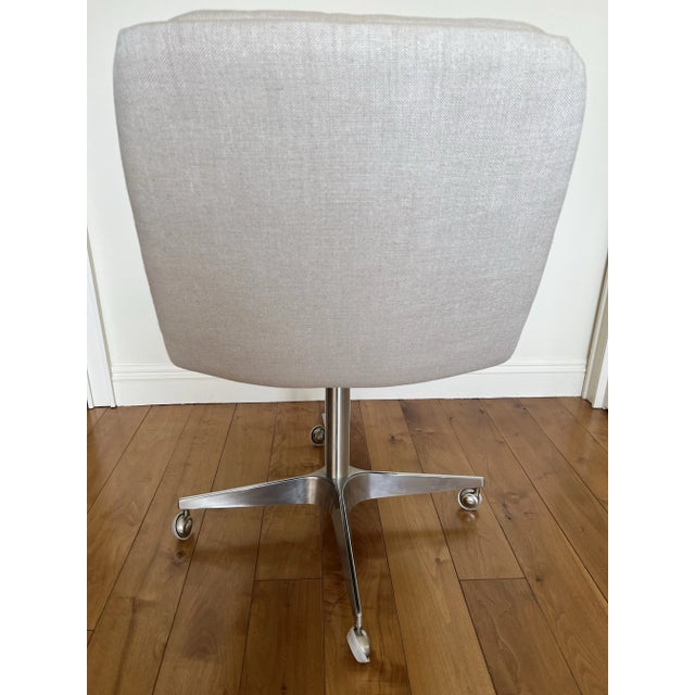 Restoration Hardware Griffith Linen Desk Chair Set atop a smooth-rolling caster base, the padded seat and back – accented...