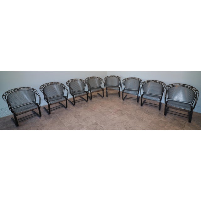 A complete set of eight Russell Woodard wrought iron casual chairs from the sought-after Ivy Leaf line. Each chair...