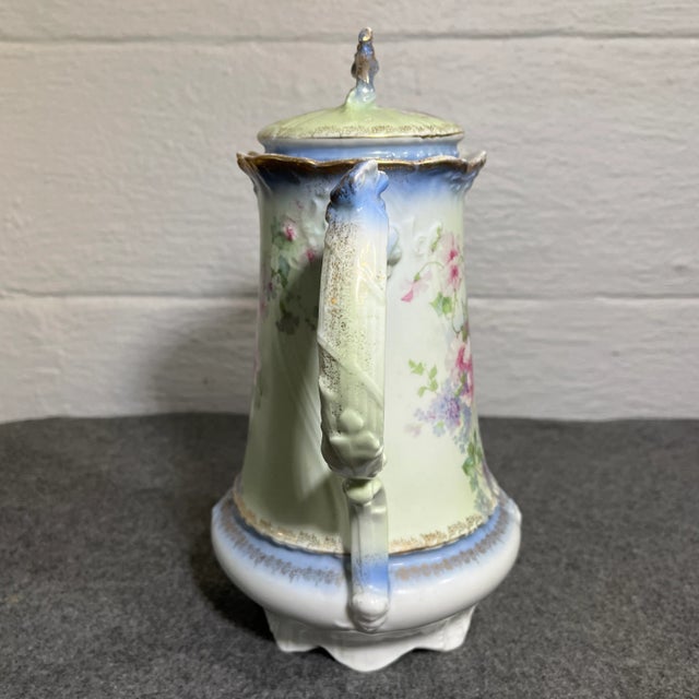 Incredible detail and craftsmanship to this lidded coffee/chocolate pot. Soft green body, white base, and pink & lavender...