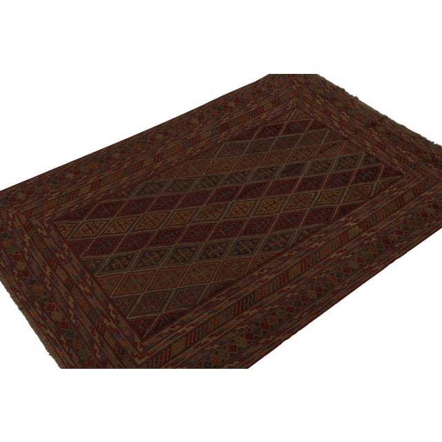 Hand knotted in wool, this 7x9 Baluch rug represents a new line of tribal carpets in the Modern Classics Collection by Rug...