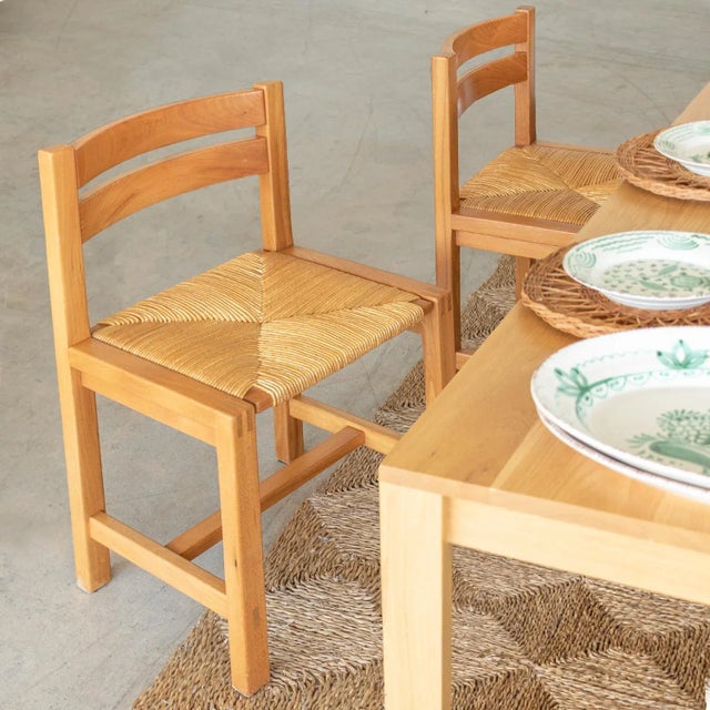 Incredible set of four elm and woven chairs by Maison Regain from France 1950's. Solid legs with beautiful curved wood...