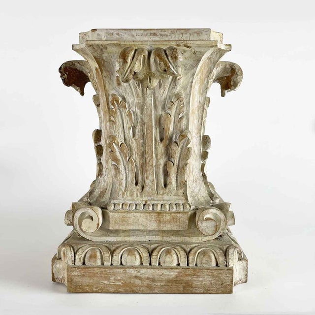 Pair of Carved Acanthus Leaf Capitals, Florence, 1900. A pair of Florentine pedestal table bases in carved wood, decorated...