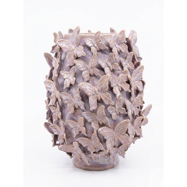 This striking vintage Italian ceramic vase is a masterclass in sculptural texture and whimsical design. The vessel...