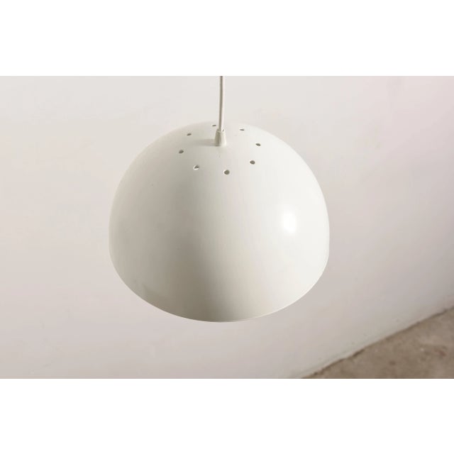 A set of six elegant modern metal hanging lamps painted white designed by Raak the best known for their organic modern...