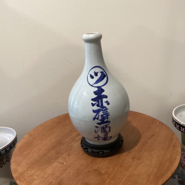 Antique Japanese Tokkuri (Sake Long Neck Bottle) W/ Blue Underglaze Calligraphy on Wood Base For Sale - Image 9 of 12