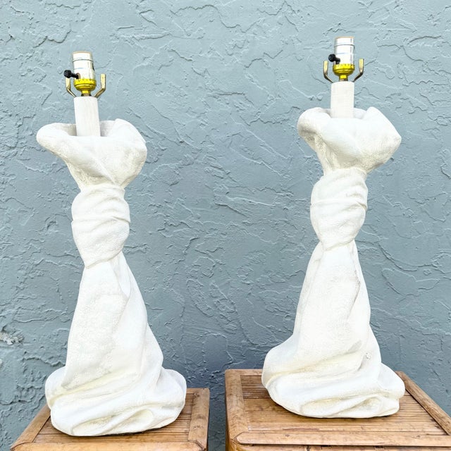 Striking pair of vintage sculptural table lamps in the iconic style of John Dickinson, featuring dramatic draped and...