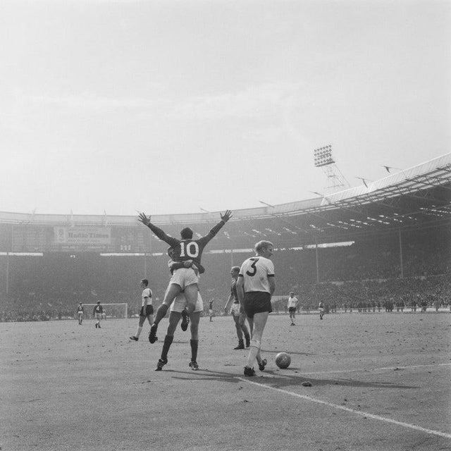 World Cup Final 1966 England footballer Geoff Hurst (10) being hugged by a team-mate at Wembley Stadium in London, during...