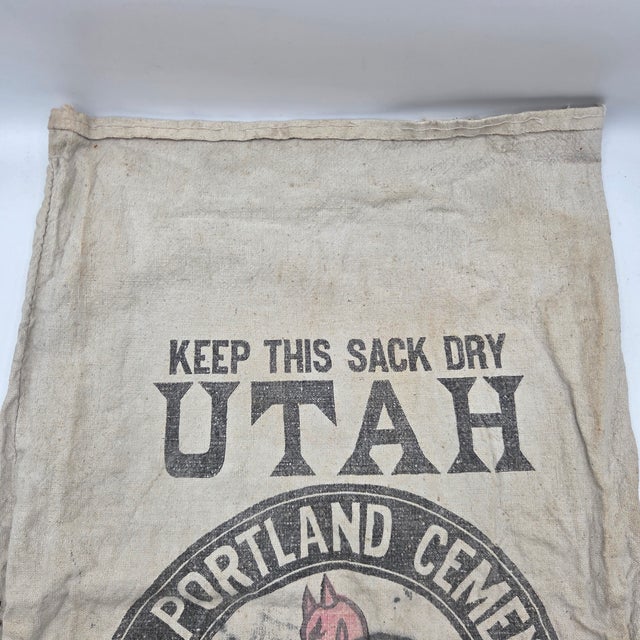 An authentic antique Union Portland Cement Co. canvas cement sack from Devil's Slide, Utah, dating to the 1920s–1930s....