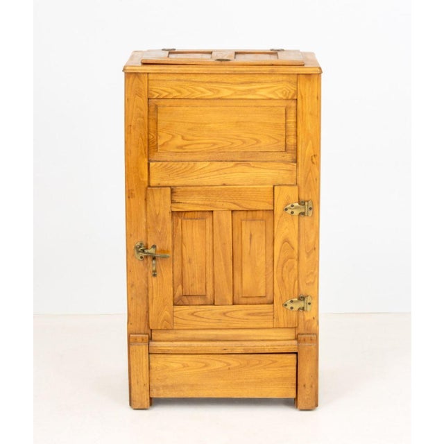 American Oak Ice Chest, with lift top compartment above single door cabinet, metal liners to interior. 38" H x 21.25" W x...