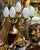A stunning French Rococo style candelabra lamp featuring seven elegant lights supported by an ornate gilded bronze...