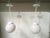 A sophisticated pair of mid-century modern pendant lights manufactured by the renowned Feldman Company of Los Angeles,...
