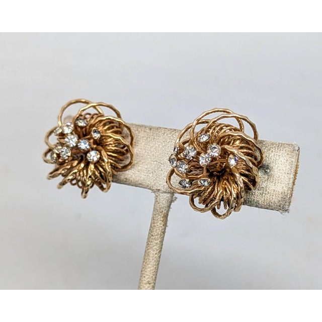 1960s round looped goldtone with wires sticking up from the centers with prong set round clear rhinestones at the ends...