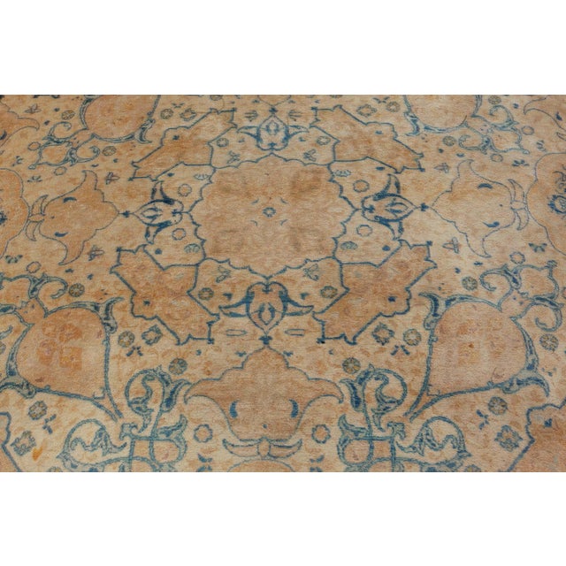 This circa-1920 antique Persian Tabriz rug is a delicate display of an all-over design featuring floral abstraction...