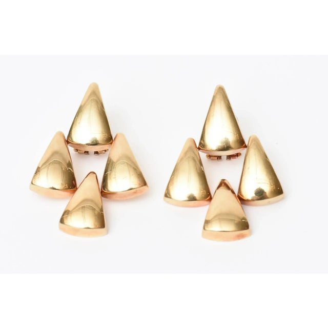 This is part of Chairish’s Fine Jewelry assortment. These sculptural Italian pierced lever back 14K gold dangle chandelier...