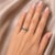 Elegant 18K white gold eternity band featuring 9 natural oval emeralds (1.5 CT) accented with 8 round brilliant diamonds...