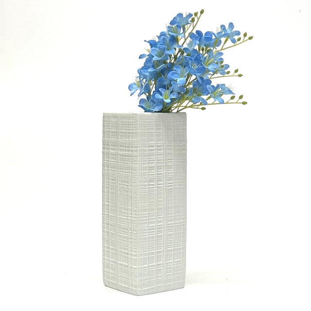 A gorgeous and rare white bisque porcelain vase by Rosenthal Studio Line, circa 1990s. This vase is a rectangular, four-...
