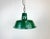 Industrial green pendant light made in Poland during the 1960s. White inside the shade. Iron top. The porcelain socket...