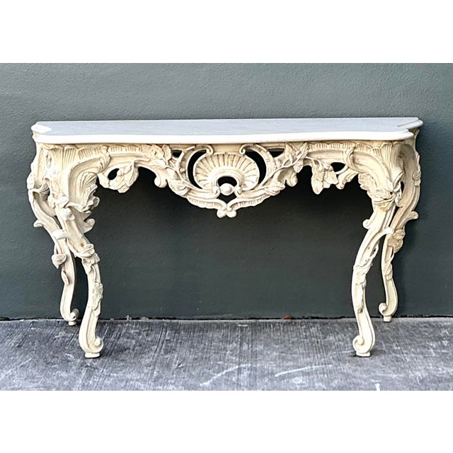 Elevate your entryway with this magnificent Louis XVI-style console table, a stunning tribute to the opulence of French...