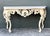 Elevate your entryway with this magnificent Louis XVI-style console table, a stunning tribute to the opulence of French...