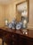 Elevate your tabletop or mantel decor with this striking pair of vintage glass hurricane candle holders. Rendered in a...