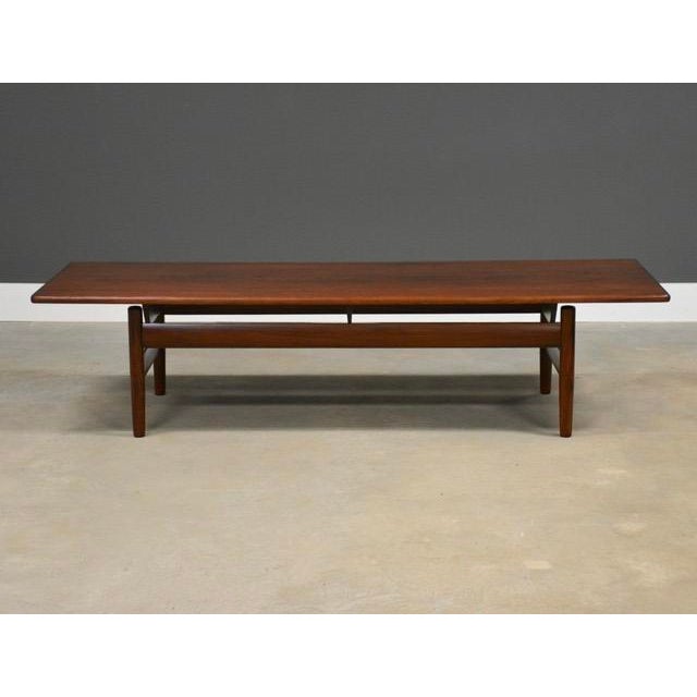 A mid century modern teak coffee table by Karl Sørlie for Sørlie and Sonner. Made in Norway. Professionally refinished....