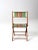 This is a vintage children's folding chair. The wood frame beach or camp chair features a green cotton seat and back rest...