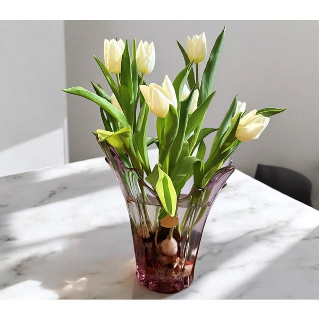 This large asymmetrical vase is a high-quality pink crystal artwork, crafted by renowned Belgian crystal manufacturer Val...