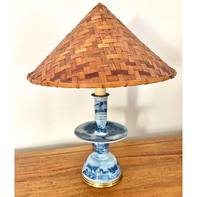 Fabulous Japanese porcelain candelabra table lamp with wicker shade. The conical lampshade is an actual Asian rice hat...