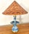 Fabulous Japanese porcelain candelabra table lamp with wicker shade. The conical lampshade is an actual Asian rice hat...