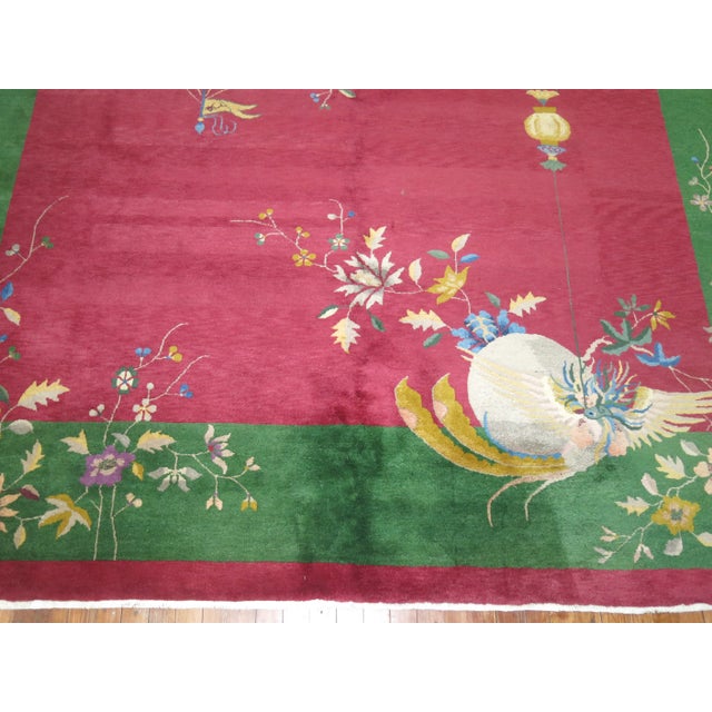 Stunning Chinese Art deco rug with jewel toned colors. Rug features full pile in excellent condition with no repairs. It...