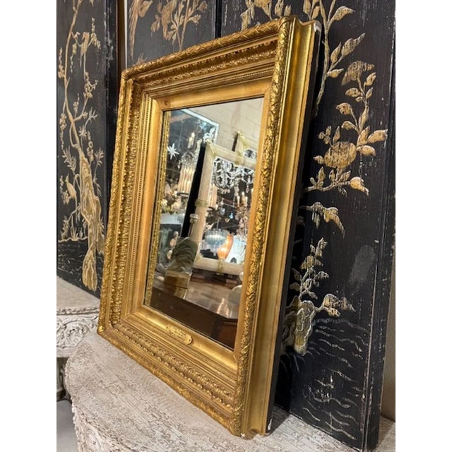 The 19th Century English Giltwood Mirror is a stunning piece of antique furniture that exudes elegance and sophistication....