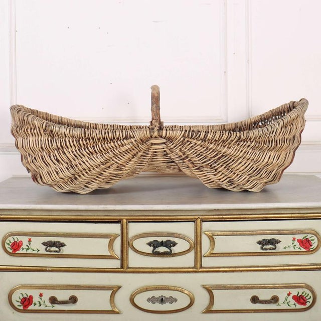Nice and clean French Burgundy grape picking baskets. Made in the shape to fit on a donkey. 1920 Dimensions:W: 110cm...