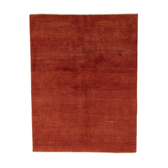 An expressive Gabbeh Loribaft rug with an intense red color scheme and a calm, puristic design. This hand-knotted rug...